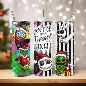 May include: Three stainless steel tumblers with different Christmas-themed designs. The first tumbler features a green Grinch character with a red Santa hat. The second tumbler has a black and white striped background with the text "Don't get your tinsel in a tangle" and a Jack Skellington character wearing a Santa hat. The third tumbler has a black and white striped background with a Zero character and a green Grinch character wearing a Santa hat.