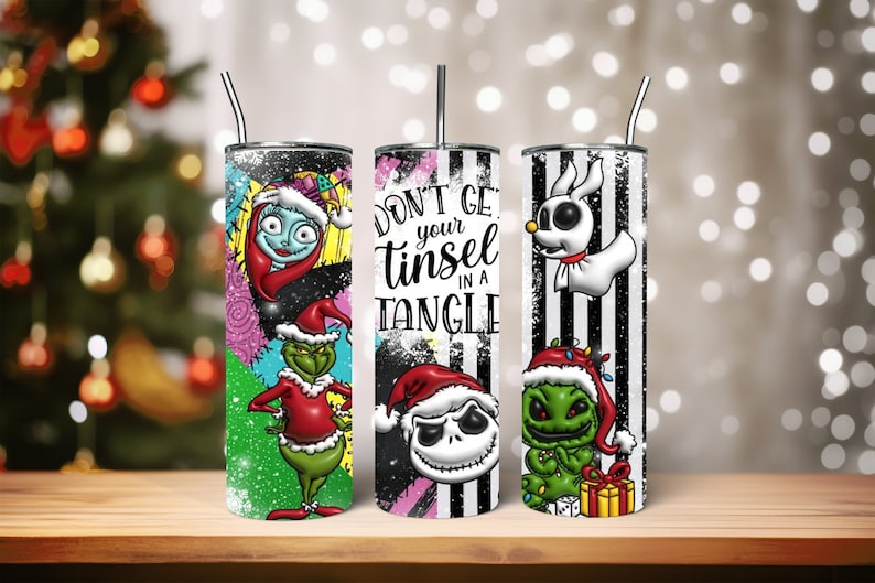 May include: Three stainless steel tumblers with different Christmas-themed designs. The first tumbler features a green Grinch character with a red Santa hat. The second tumbler has a black and white striped background with the text "Don't get your tinsel in a tangle" and a Jack Skellington character wearing a Santa hat. The third tumbler has a black and white striped background with a Zero character and a green Grinch character wearing a Santa hat.