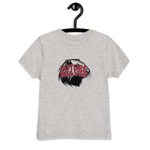 May include: A light gray t-shirt with a black and red graphic of a beaver's head and the words "FUTURE BEAVER". The shirt is hanging on a black hanger.