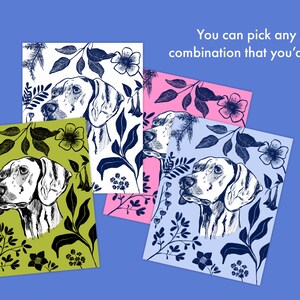 Four different color variations of a dog illustration with floral designs surrounding it. The dog and the floral designs are in black or dark blue and the background colors are white, light blue, pink, and green. There is text that says "You can pick any color combination that you'd like".