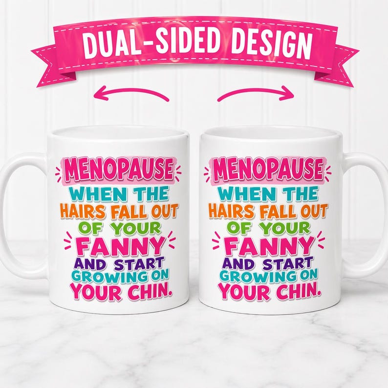 May include: Two white ceramic mugs with the text "MENOPAUSE WHEN THE HAIRS FALL OUT OF YOUR FANNY AND START GROWING ON YOUR CHIN." A pink banner above reads "DUAL-SIDED DESIGN."