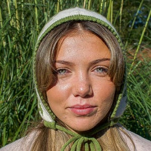 May include: A set of three ceramic mugs with a speckled, matte finish. The mugs are in shades of cream, light gray, and dark gray. Each mug has a simple, minimalist design, perfect for coffee or tea.