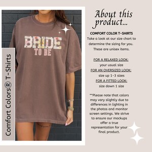 May include: A brown Comfort Colors t-shirt with the text "BRIDE TO BE" in a floral design. The shirt is unisex and has a relaxed fit. The image also includes text about sizing and color variations.