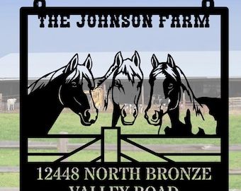 May include: Black metal sign with the text "The Johnson Farm" and "12448 North Bronze Valley Road". The sign features a silhouette of three horses looking over a fence.
