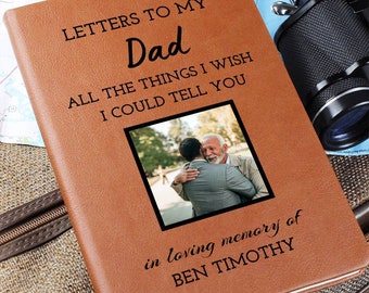 May include: A brown leather journal with the text "Letters to My Dad All the Things I Wish I Could Tell You" and a photo of two men hugging. The text "in loving memory of BEN TIMOTHY" is also on the journal.