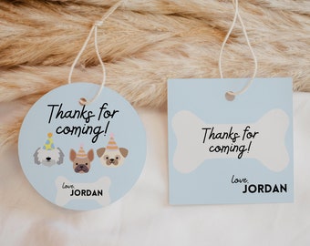 May include: Two blue and white thank you tags with the text "Thanks for coming!" and "love, JORDAN". One tag is round with three cartoon dogs wearing party hats. The other tag is a square with a bone shape.