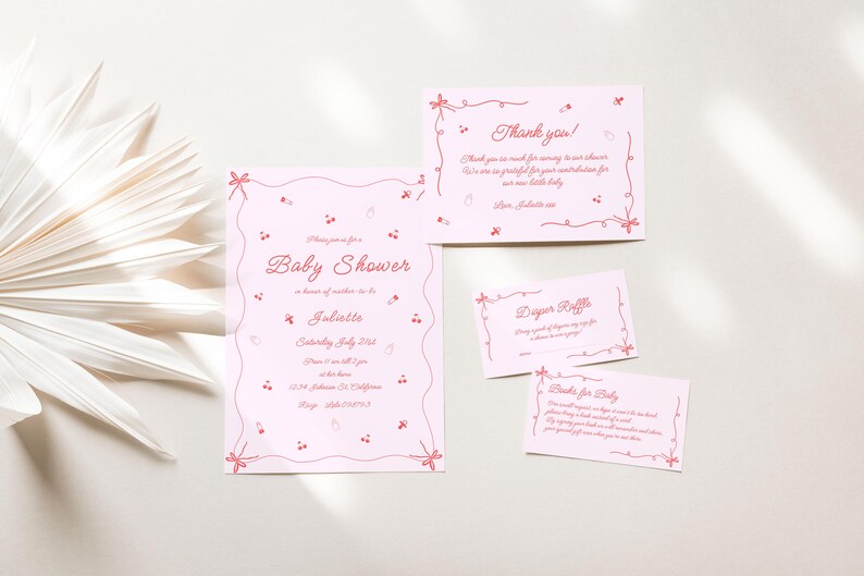 May include: Pink baby shower invitation cards with a delicate floral design. The cards include a main invitation, a diaper raffle card, and a thank you card. The text on the main invitation reads "Baby Shower in honor of Juliette, Saturday, July 21st, 12:30-4:00pm, The Loft, 1234 Somewhere Drive, City, State, 12345".