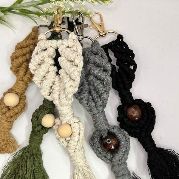 Large macrame keychain clips with wooden bead detail.  Cream, gray, khaki/tan, and black.  Light weight, cotton. Great gift idea!