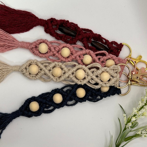 Delicate macrame keychain clips with natural wood bead detail.  Cream, navy, pink, rose, burgundy, maroon.  Lightweight, cotton.