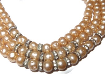 Drie strengen banquetteglas parelketting met rondell strass-kralen
