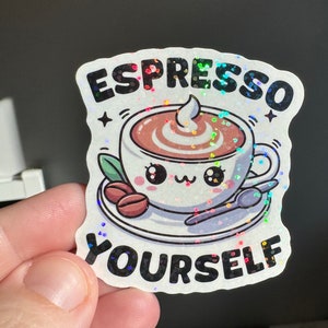 sticker featuring a cute espresso cup with the playful phrase “Espresso Yourself”.