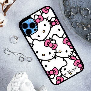 May include: Black phone case with a white background and multiple cartoon images of Hello Kitty with pink bows. The text "Your Name" is printed on the bottom right corner of the case.