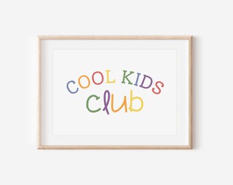 May include: A framed print with the text "COOL KIDS CLUB" in a rainbow of colors. The letters are stylized and playful.