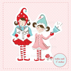 May include: A sticker featuring two cartoon elves. One elf sings from a book labeled "Songs", wearing a red hat and skirt, and blue top. The other elf wears a pink dress and a blue hat, holding a bell. The sticker is 3 inches in size.