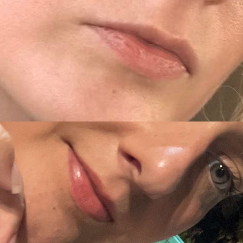 May include: Close-up of a person's face, focusing on the lips. The upper lip is a light pink, and the lower lip is a glossy, darker pink. The skin around the lips is fair.