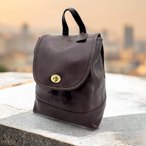 Mochila vintage COACH 9791 de piel auténtica marrón y dorada con asa superior y cierre giratorio, mochila grande de piel auténtica