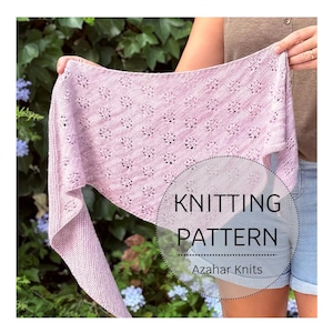 May include: A pale pink knitted shawl with a floral design is displayed against a backdrop of green foliage. The image includes the text "KNITTING PATTERN" and "Azahar Knits".