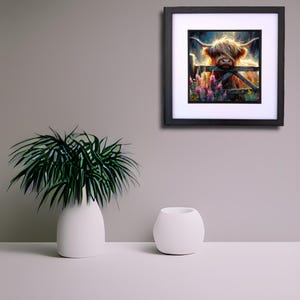 May include: A framed painting of a Highland cow with long, shaggy hair standing in a field of purple wildflowers. The cow is looking directly at the viewer.