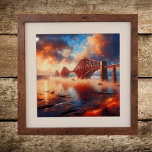 May include: A framed print of a painting depicting the Forth Rail Bridge in Scotland. The bridge is red and spans a body of water with fog in the foreground. The sky is a vibrant orange and blue with clouds.