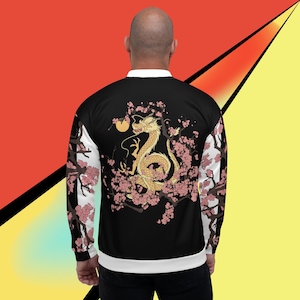 May include: A black bomber jacket with a white ribbed collar and cuffs. The back of the jacket features a gold dragon with pink cherry blossoms.