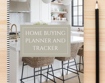 May include: A spiral-bound planner with the text "HOME BUYING PLANNER AND TRACKER" on the cover. The cover features a kitchen scene with bar stools and a pencil on a wooden surface. The planner's spine has black and white stripes.
