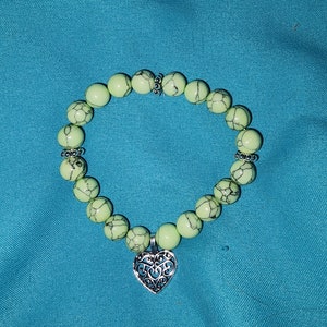Jade beaded bracelet with hanging heart