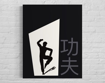 May include: A black and white rectangular wall art print featuring a silhouette of a person in a martial arts pose within a white trapezoidal shape. To the right of the figure are the large grey Chinese characters for Kung Fu.