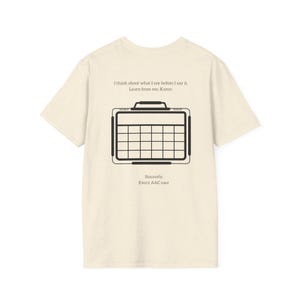May include: Cream-colored t-shirt with a black graphic of a calendar and text. The text reads, "I think about what I say before I say it. Learn from me, Karen. Sincerely, Every AAC user."