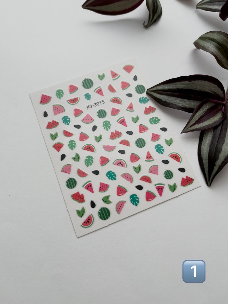 May include: A sheet of watermelon, leaf, and seed stickers. The stickers are on a white background and feature a variety of watermelon slices, leaves, and seeds. The sheet is labeled "JO-2015".
