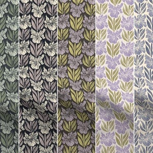 May include: A collection of floral fabric patterns. Each pattern features stylized iris flowers and leaves in various color schemes, including green, purple, and blue. The designs are repeated, creating a cohesive and decorative textile.