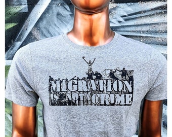 Organic T-Shirt „MIGRATION is NOT A CRIME“ – Unisex loose fit T-Shirt – Sustainably hand silkscreen printed