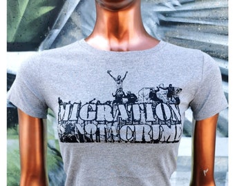 Organic T-Shirt „MIGRATION is NOT A CRIME“ – Girly / Women’s slim fit Eco T-Shirt – Sustainably hand silkscreen printed