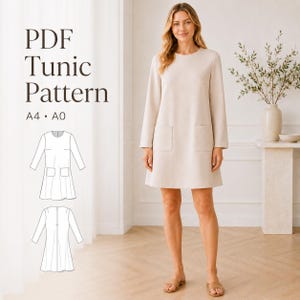 May include: A woman wearing a beige tunic dress with long sleeves and two front pockets. The image includes a line drawing of the dress and the text "PDF Tunic Pattern A4 • A0". The dress is knee-length and has a simple, elegant design.