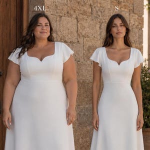 May include: Two women in white dresses with square necklines and short sleeves. The dress on the left is a 4XL size, and the dress on the right is a size S. The dresses have a simple, elegant design.