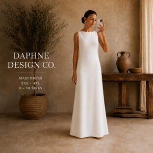 Puede incluir: Un vestido largo blanco sin mangas con cuello alto. El texto en la imagen dice: DAPHNE DESIGN CO. MAXI DRESS XXS - 4XL 0 - 30 SIZES. El vestido presenta una silueta sencilla de corte recto que llega hasta el suelo.