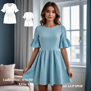 May include: A light blue dress with short sleeves and a ruffled hem. The dress has a round neckline and a fitted bodice. The dress is shown on a model in front of a window. The text "Ladies Size: 0 to 30 XS to 4XL" and "AO-A4 PAPER" is visible in the image.