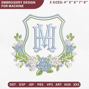 May include: Machine embroidery design featuring a light blue monogram with the letters HM inside a shield-shaped frame, surrounded by light blue and white hydrangea flowers and green leaves. Text includes EMBROIDERY DESIGN FOR MACHINE, 5 SIZES: 4" 5" 6" 7" 8", and file formats DST, EXP, JEF, PES, VP3, ART, HUS, XXX.