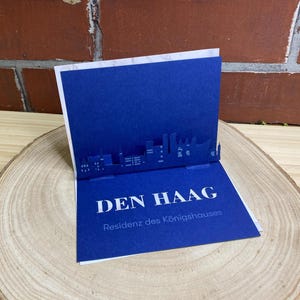 Carte pliante La Haye - Skyline 3D de diverses villes - Carte cadeau / carte-cadeau de voyage à plier avec silhouette La Haye