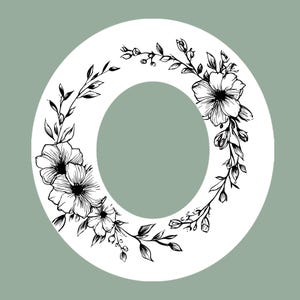 May include: A white letter "O" adorned with a black floral illustration. The flowers and foliage are detailed, creating a botanical design. The background is a soft, muted green, complementing the monochrome letter. A decorative element.