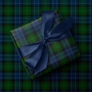 Tartan Christmas wrapping paper in green and navy for traditional holiday style