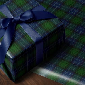 Tartan Christmas wrapping paper in green and navy for traditional holiday style