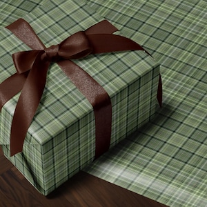 Christmas plaid wrapping paper roll with green tartan pattern for holiday gift wrapping