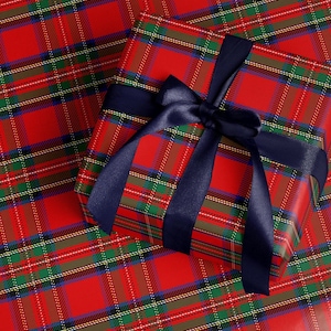 Tartan Christmas wrapping paper with a royal steward red plaid pattern for elegant holiday gifts.