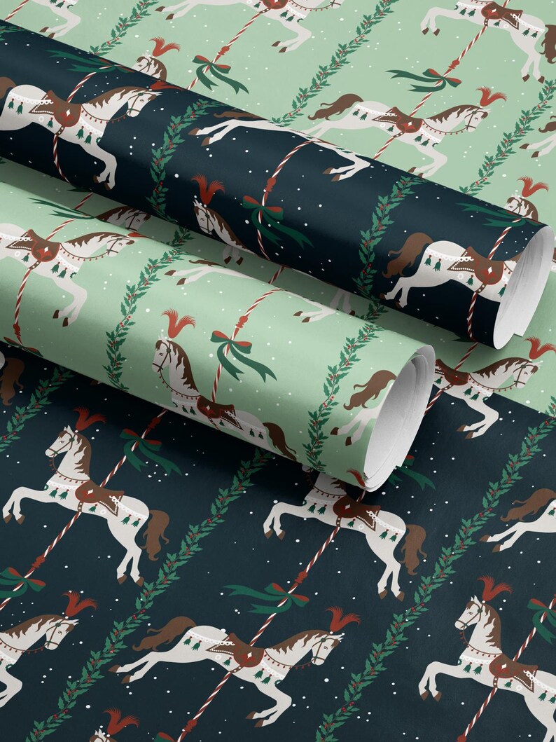 May include: Rolls of wrapping paper with a repeating pattern of carousel horses in white and brown, accented with red and green details. The background alternates between a dark teal and a light green, with a festive holiday theme.