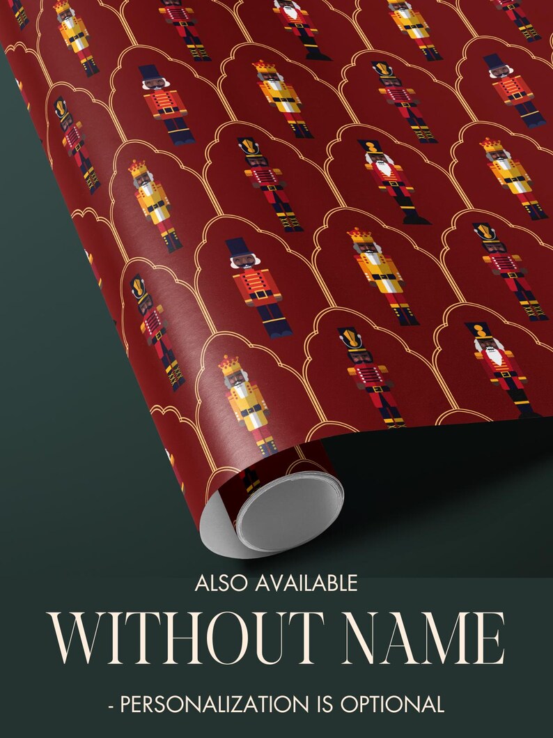 May include: A roll of wrapping paper featuring a repeating pattern of nutcracker figures in red, yellow, black, and blue. The background is a deep red with gold decorative accents. Text at the bottom reads "ALSO AVAILABLE WITHOUT NAME - PERSONALIZATION IS OPTIONAL."