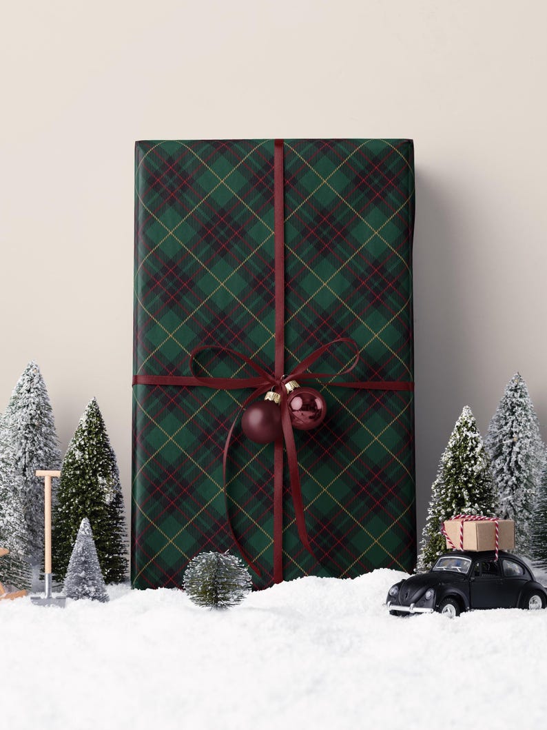 Green tartan plaid paper with a classic look, perfect for wrapping traditional Christmas gifts.