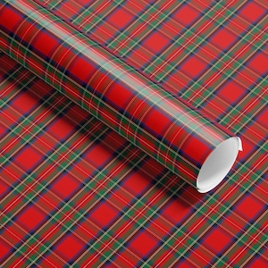 Classic red plaid wrapping paper with vintage tartan and Christmas motifs, perfect for traditional gift wrap.