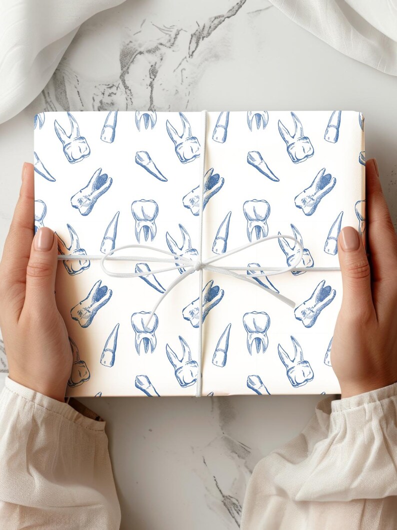 May include: A wrapped gift with a white background and a repeating pattern of blue teeth illustrations. The gift is tied with a white string. The overall theme is dental or medical.