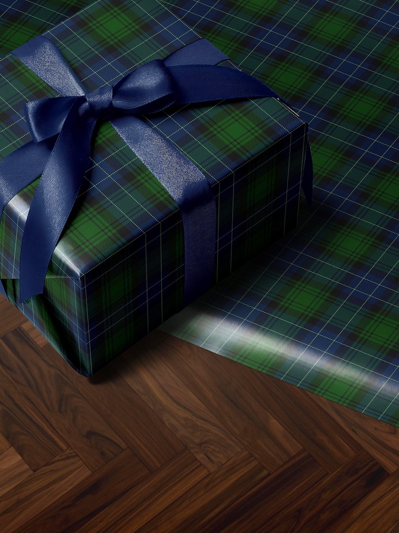 Tartan Christmas wrapping paper in green and navy for traditional holiday style