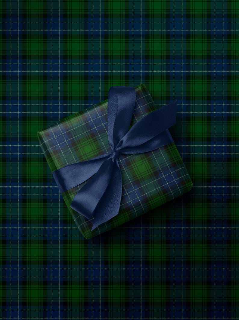 Tartan Christmas wrapping paper in green and navy for traditional holiday style